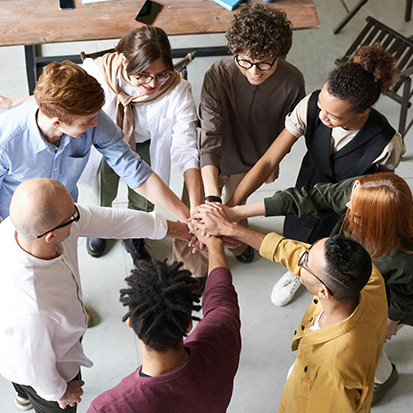 team uniting hands. Photo by fauxels